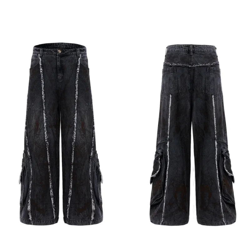 Black loose-fit denim jacket and trouser set with a splash-dye gradient pattern and padded shoulders.