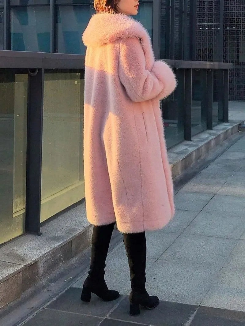 Women's grey faux rabbit fur mid-length coat with leather trim and a thick fur collar.