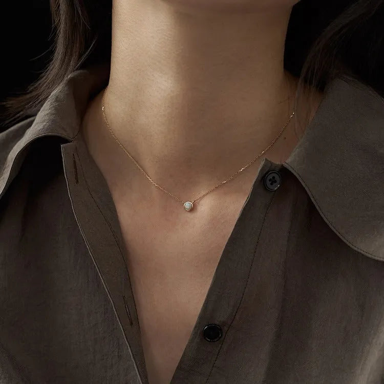 Oval geometric jelly opal pendant necklace with silver plating in gold or white gold colour.