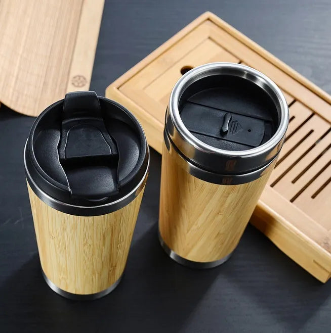 Bamboo insulated travel coffee cup with lid, showing anti-slip base pad, 420ml capacity.