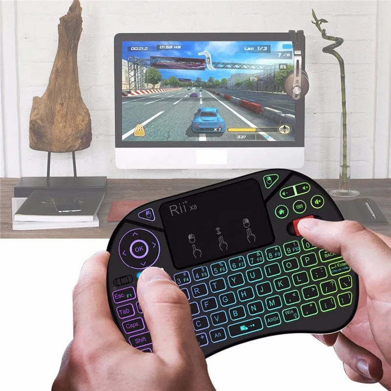 Black i8X wireless keypad with 71-key QWERTY layout, larger touchpad and dual mouse buttons