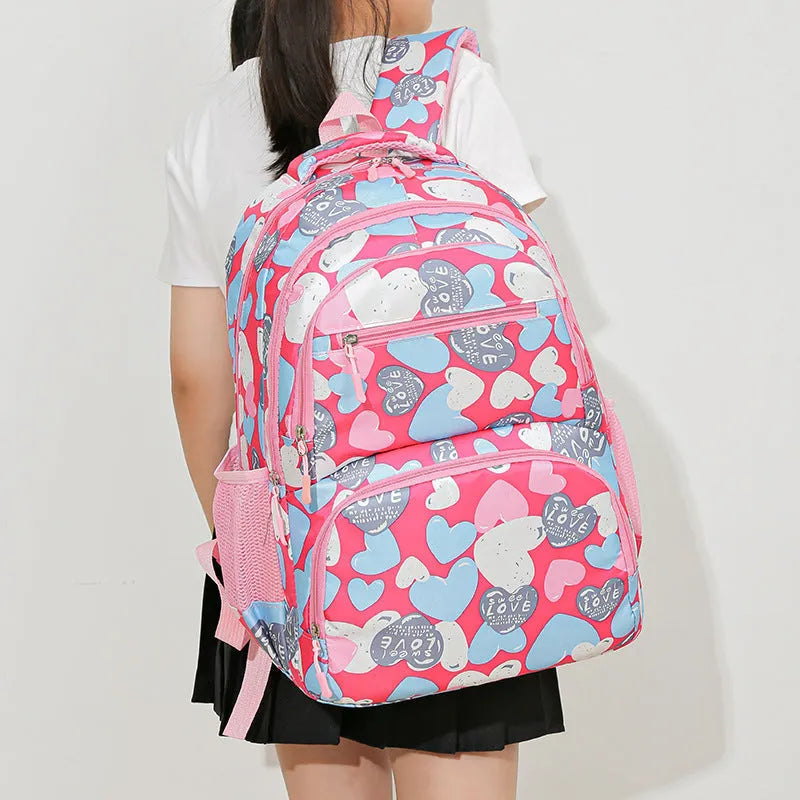 Blue student schoolbag with air pillow belt system for back burden alleviation