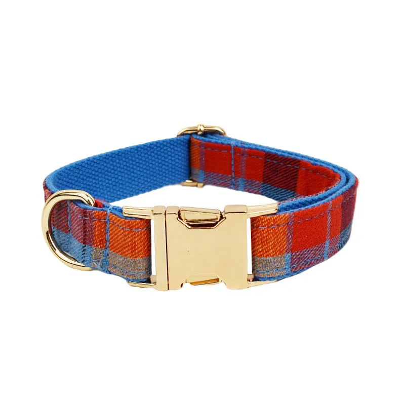 Gentleman-style dog collar, leash, bow, and vest four-piece cloth pet accessory set laid out flat.