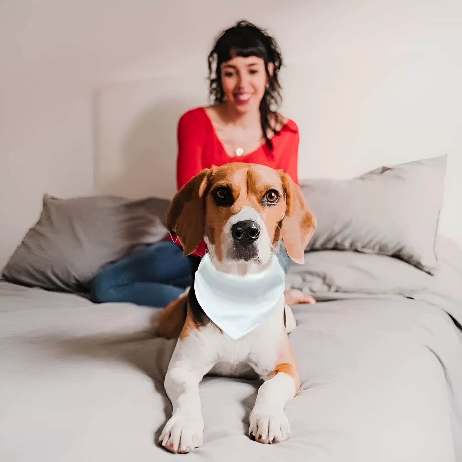 Blank white polyester dog bandana scarf laid flat, showing its triangular shape.
