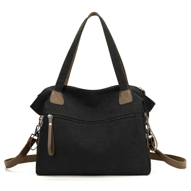 Women's retro style canvas shoulder bag with internal organiser pockets in horizontal square shape