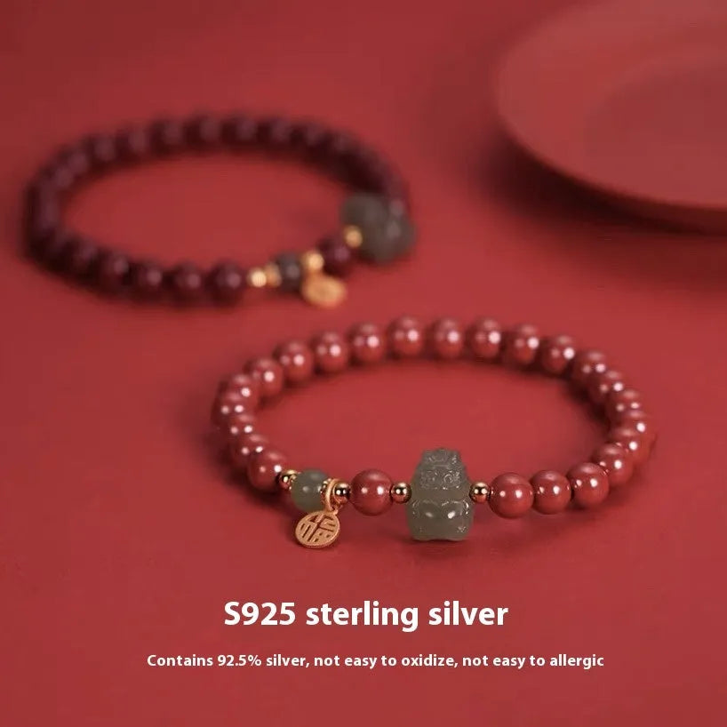 Natural Hetian Jade bracelet in 8mm diameter with animal zodiac motif.