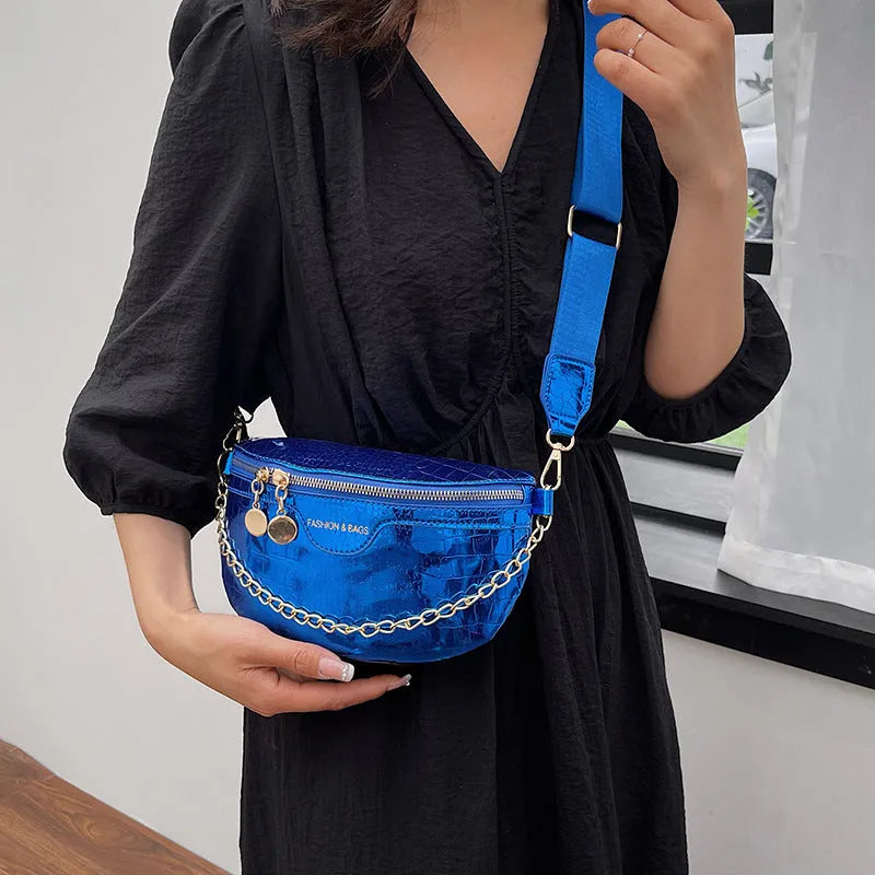 Shiny chest bag with WesternWide shoulder strap, chain detail, and hard PU shell in black colour