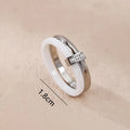 Women's titanium steel heart-shaped double ring with glossy stitching and inlaid zirconium stones in three colour options.