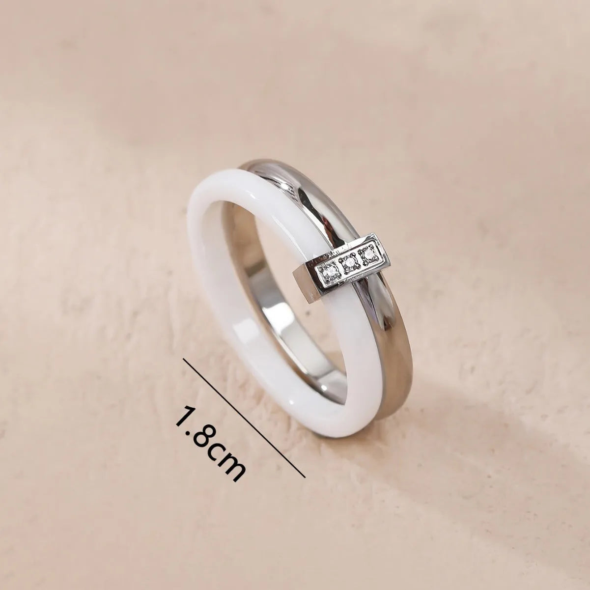 Women's titanium steel heart-shaped double ring with glossy stitching and inlaid zirconium stones in three colour options.