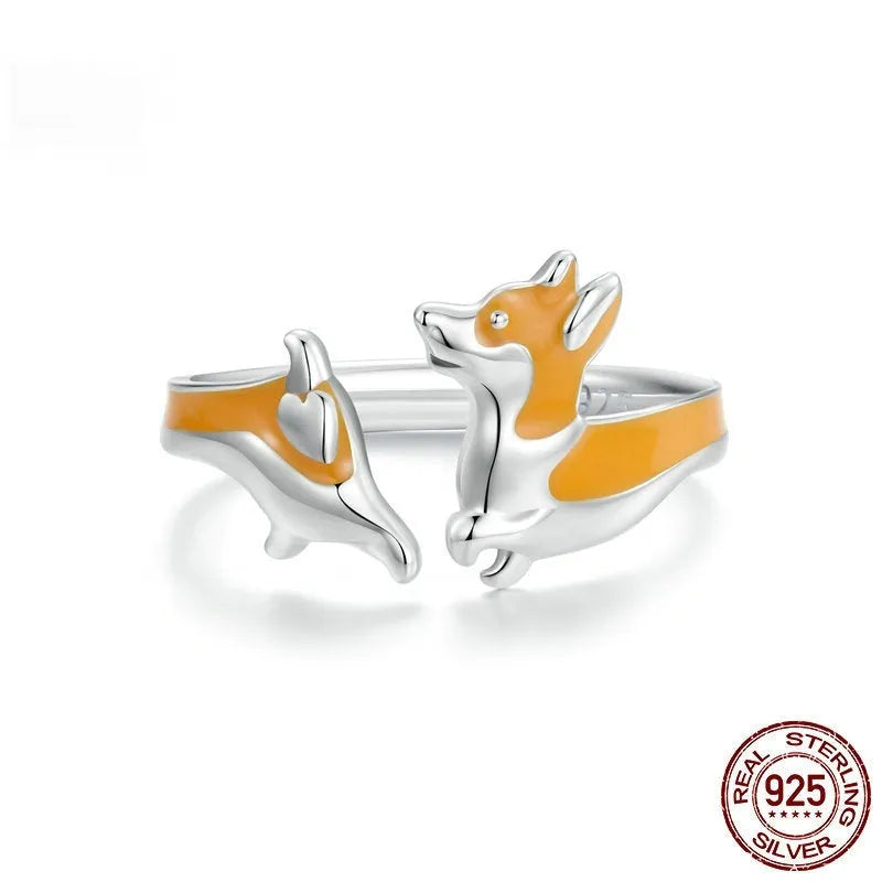 Silver electroplated cartoon corgi fashion ring for women on a white background.