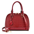 Shiny black PU leather crossbody shoulder bag with a structured shell shape