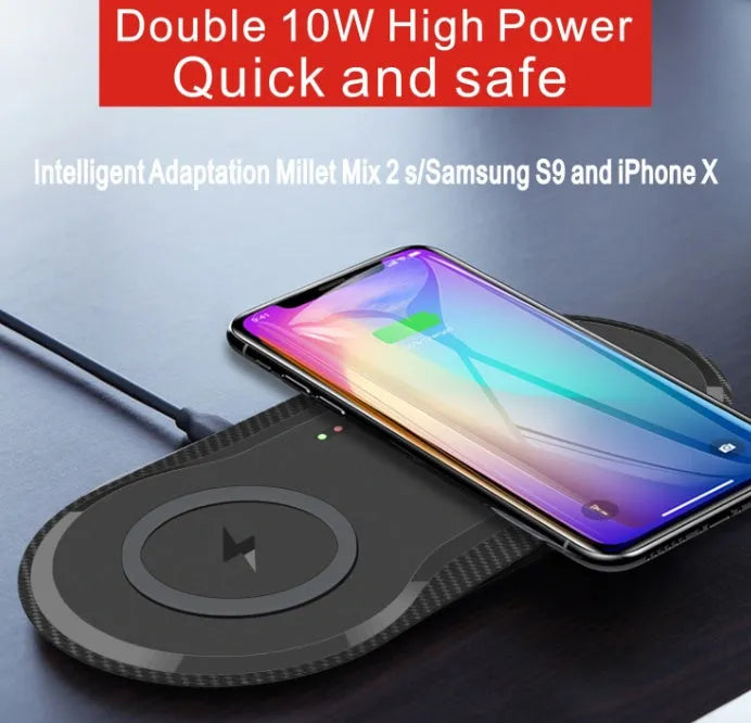 Black and white dual wireless charger charging two smartphones simultaneously on anti-slip silicone base