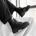 Men's black platform Doc Martens boots with zipper closure and frosted cowhide leather