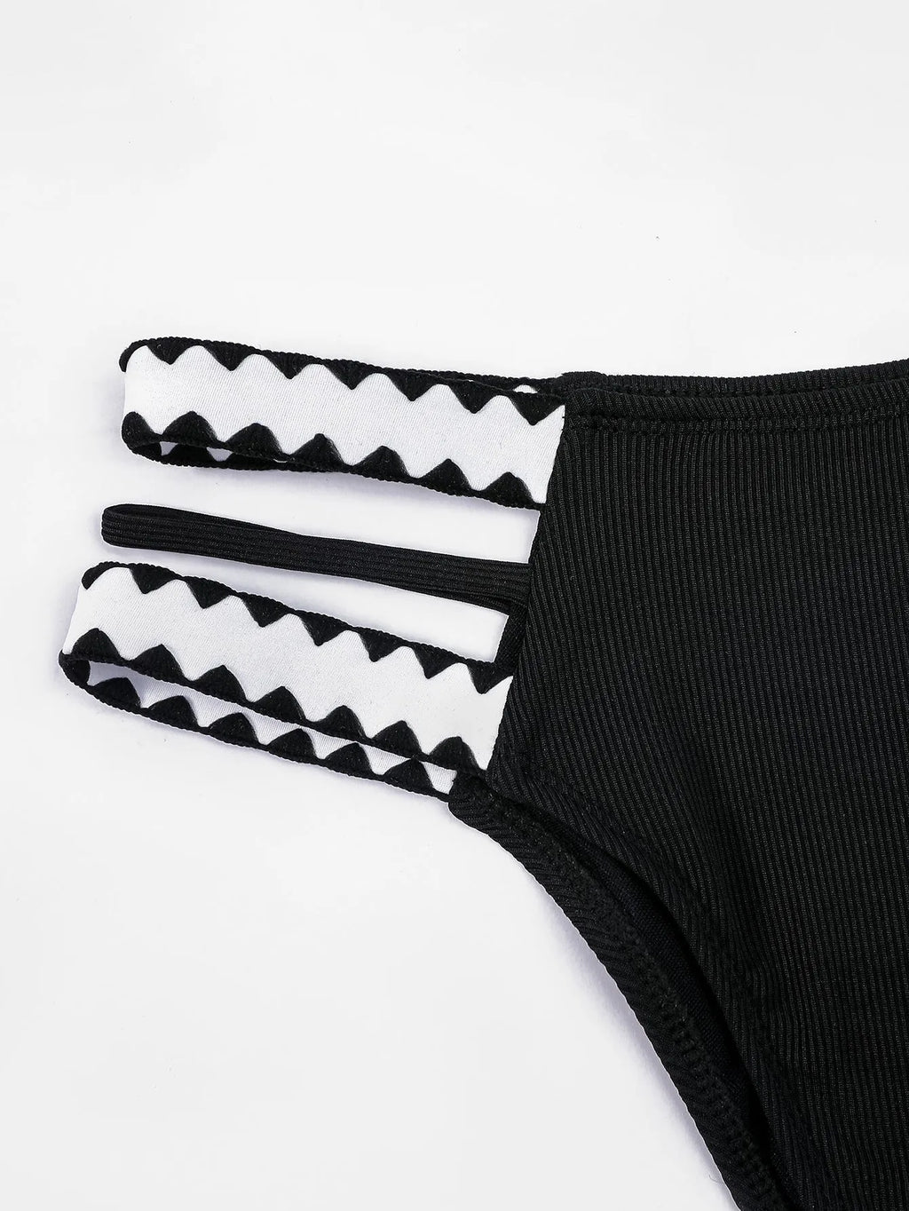 Black women's hollowed-out split swimsuit bikini set on a mannequin.