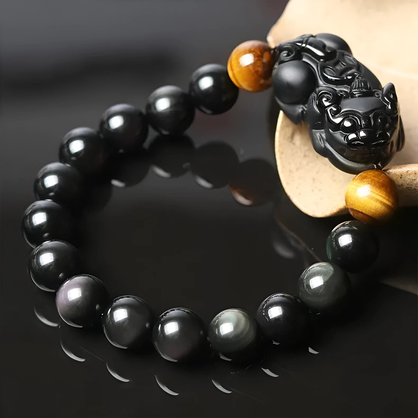 Black Mexican Gold Sheen Obsidian Pi Xiu charm bracelet with crystal beads.
