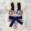 Blue leaf orange printed high waisted bikini swimsuit for women on mannequin