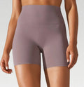 Women's high waist fitness tights in dark green for belly control and hip lift during exercise
