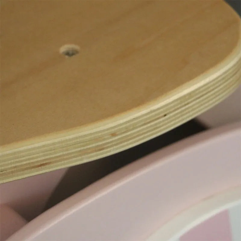 Pink wooden balance scooter for toddlers, 10 inches in size.