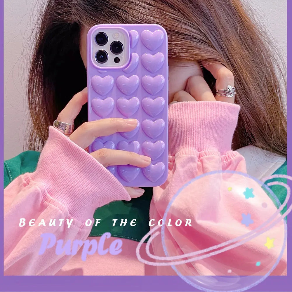 Solid colour 3D heart iPhone case in TPU, back cover style with fall protection, shown for iPhone models