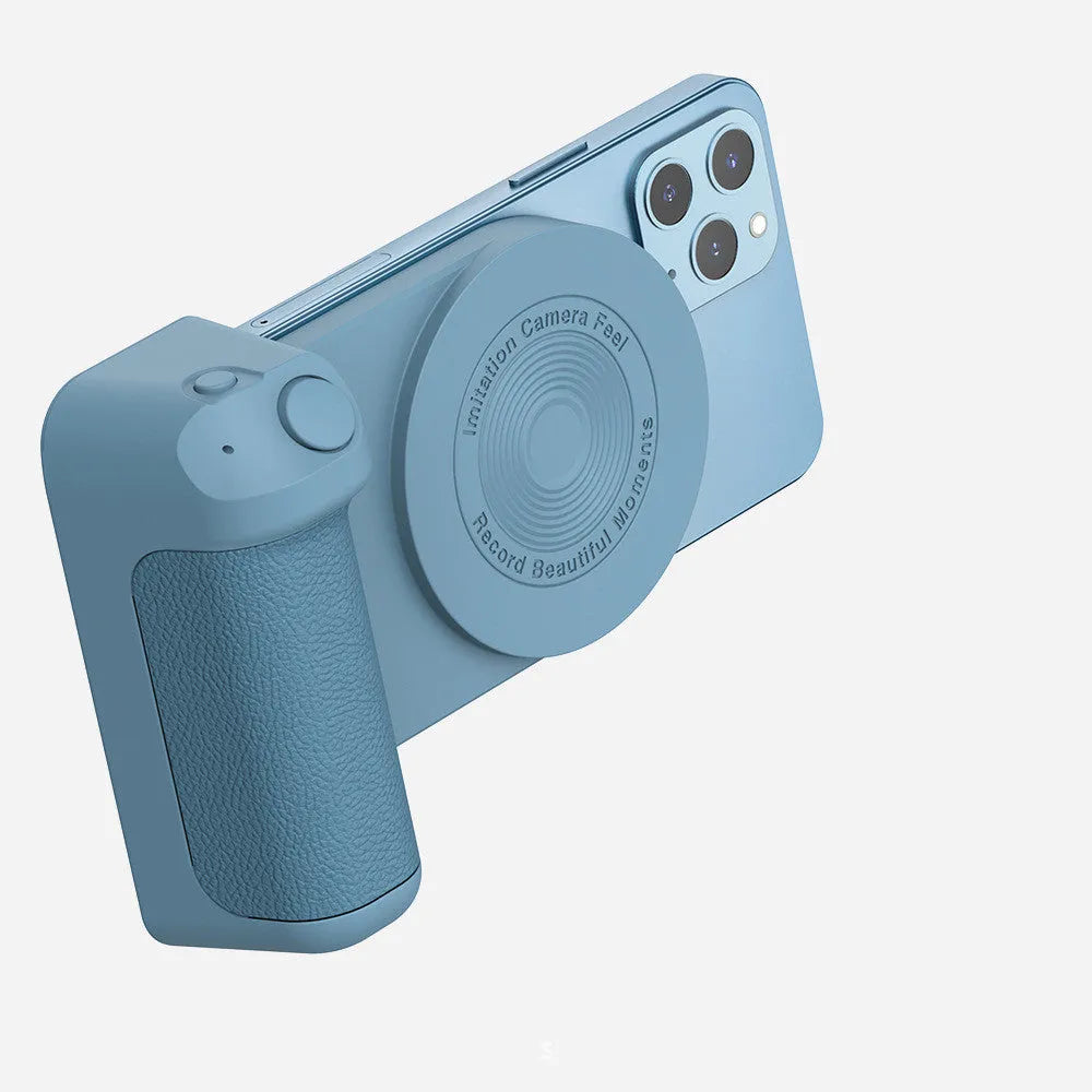 Black magnetic phone camera holder with rotatable grip on wooden table demonstrating phone attachment