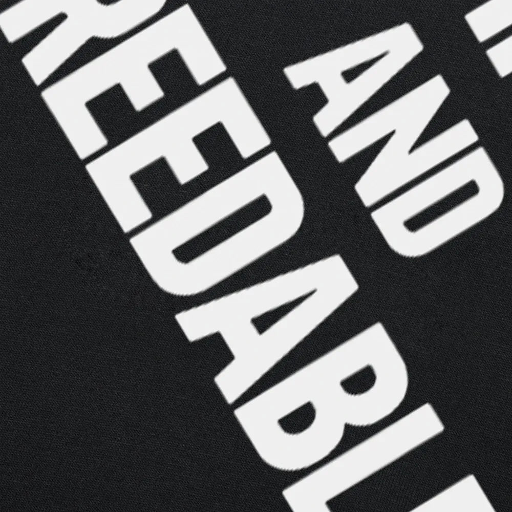 Loose fit cotton T-shirt with a humorous graphic print, shown in a black colour variant.