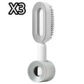 Self-cleaning hair brush with air cushion bristles in black gold, white, or purple colours