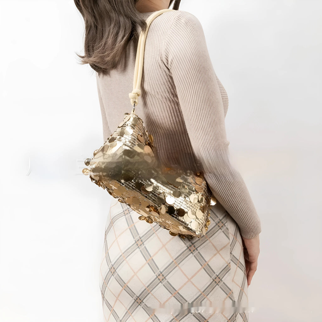 Soft polyester women's crossbody bag shown in black, gold, or silver, with an adjustable shoulder strap.