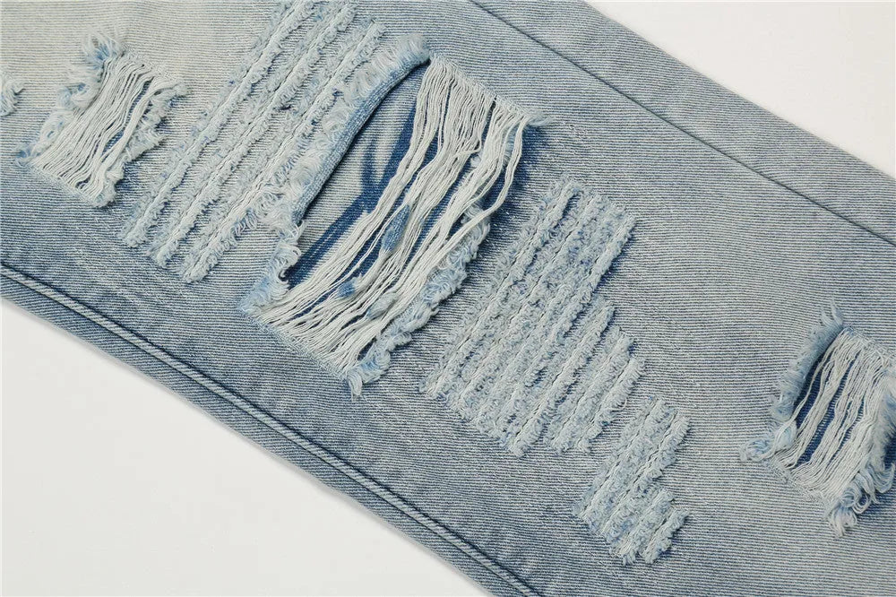 Men's flared washed jeans in light blue denim with zipper fly