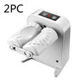 White automatic electric dumpling maker machine with USB cable and accessories on a kitchen counter.