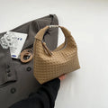 Soft PU leather messenger bag in bucket shape with internal document compartment, shown in a choice of colours.
