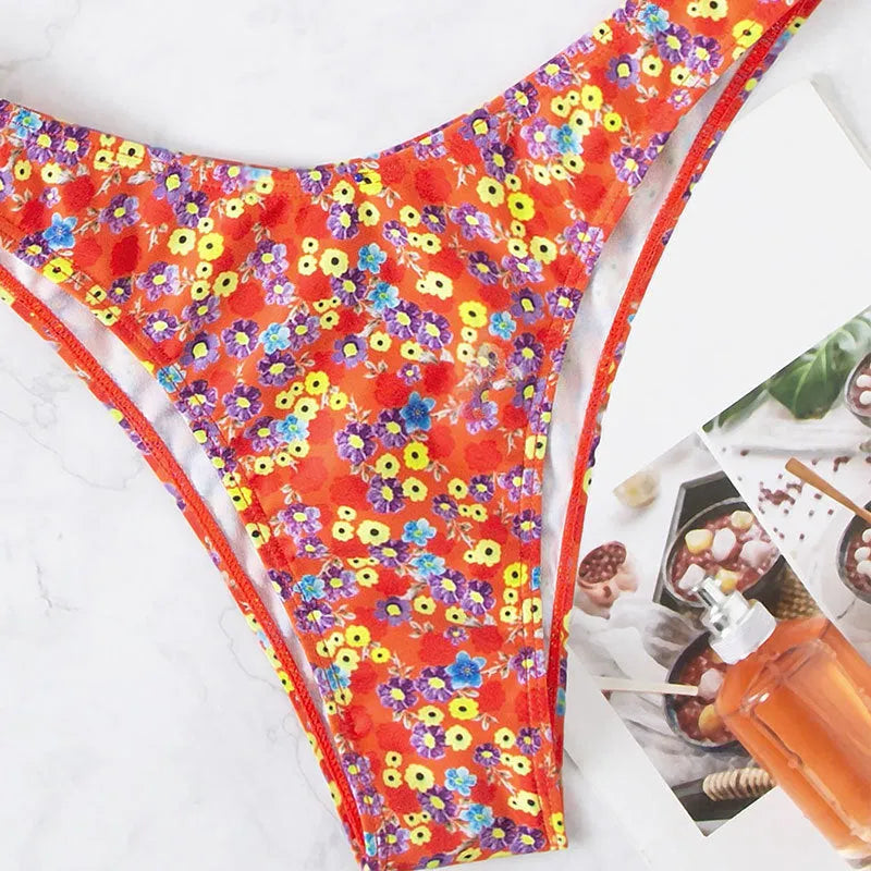 Red floral high waist split swimsuit for women on a white background.