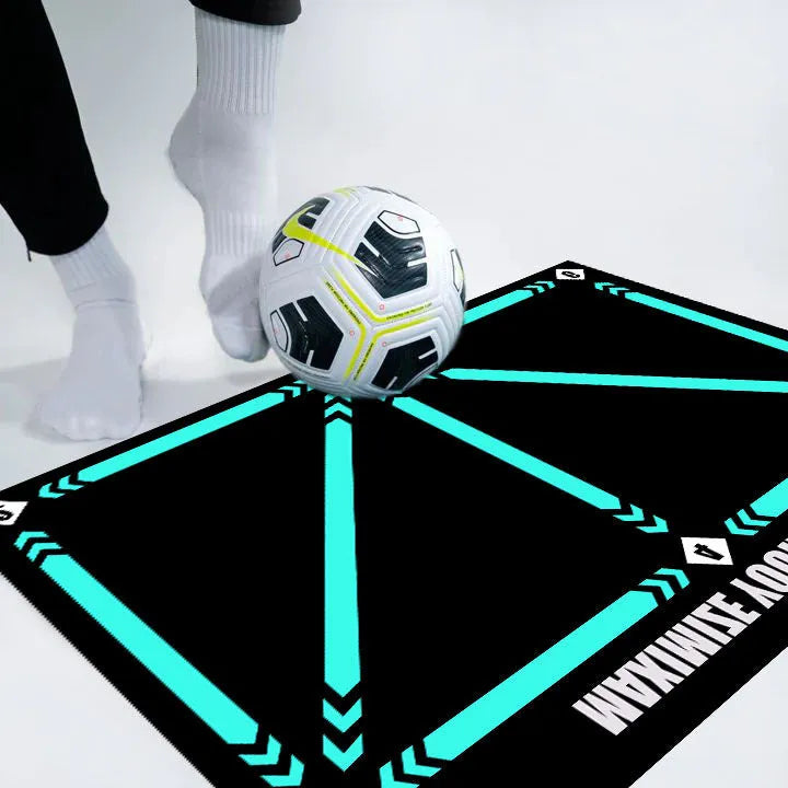 Black rectangular football training mat on grass for non-slip skills practice