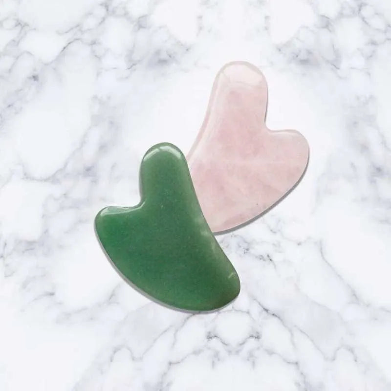 Jade roller massager with rose quartz gua sha stone, dual-sided natural jade facial tool for tension relief and skincare absorption.