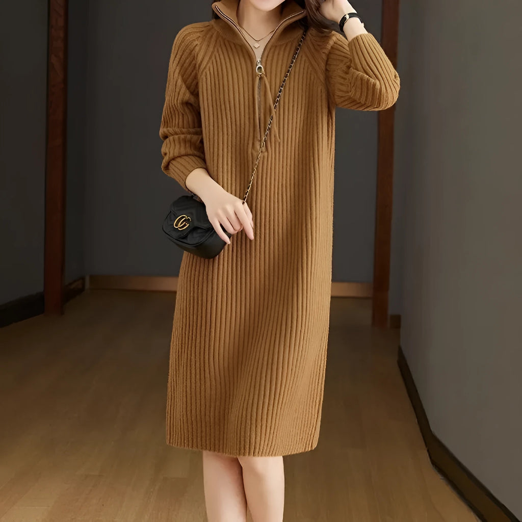 Beige casual skirt with half front zipper, stand collar, and long sleeves on a mannequin.