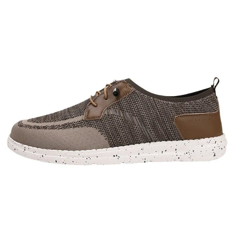 Men's black laceless canvas shoes with low-top design and round toe