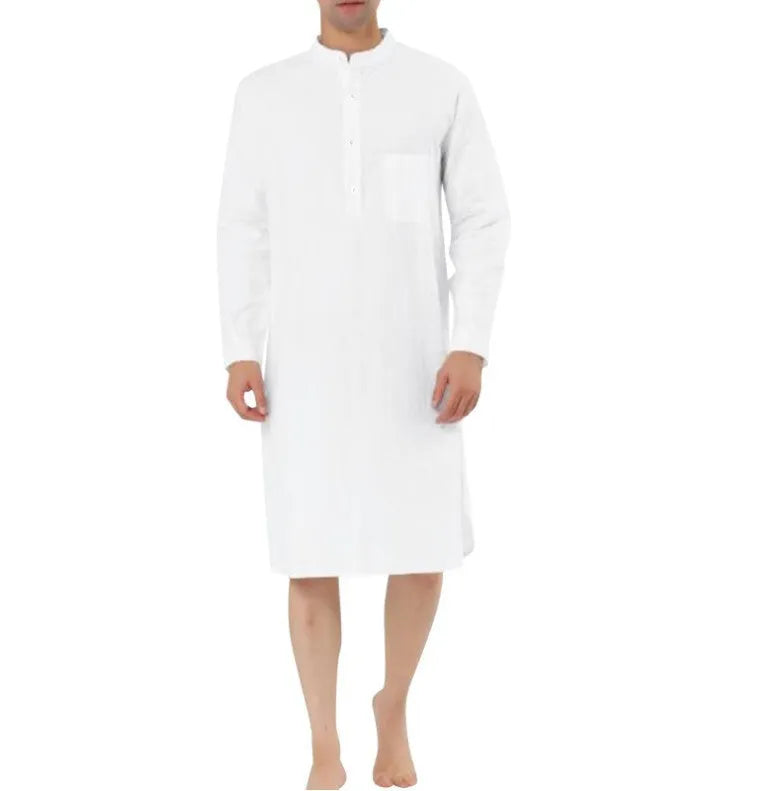 Man wearing a light blue cotton shirt robe with front pockets, showing the full-length opening and relaxed fit.