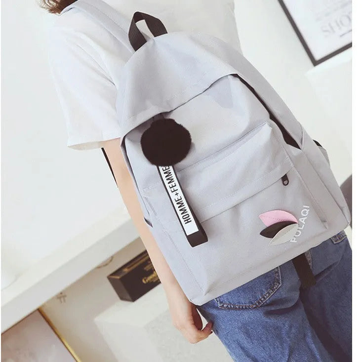 Canvas college style schoolbag in green colour showing front view with dimensions 40x28x13cm