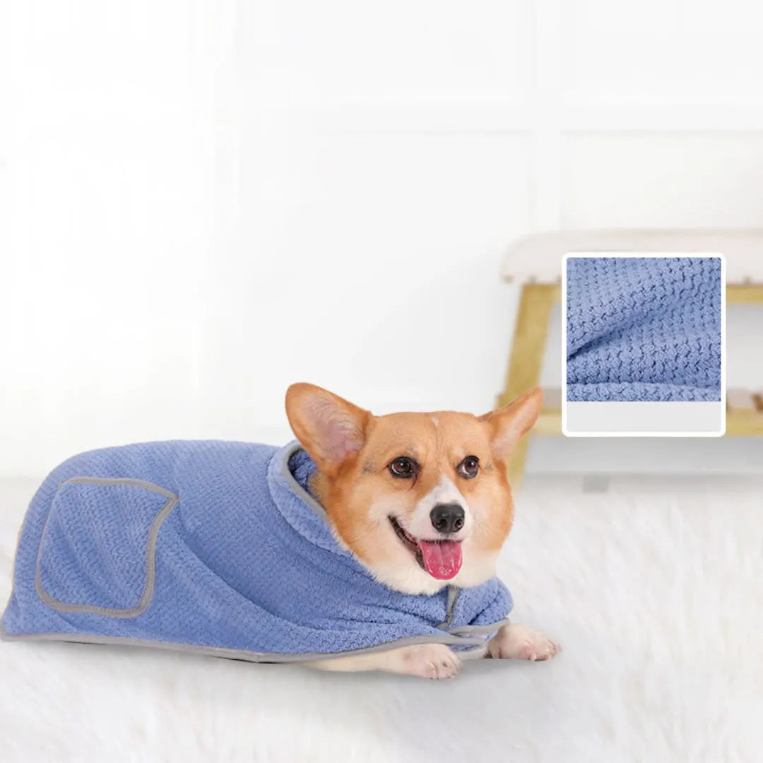 Blue dog bath robe with adjustable waistband fastened on a dog, showing absorbent fabric and sizing for drying.
