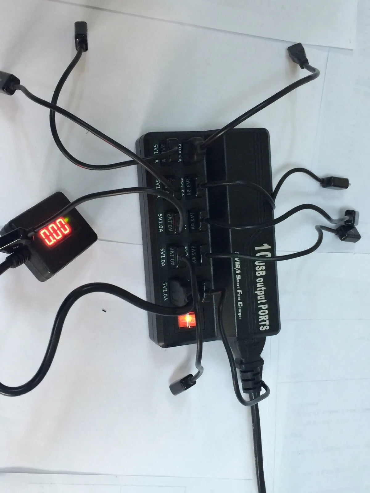 10 Port USB charger power strip in 838 black with multiple cables connected