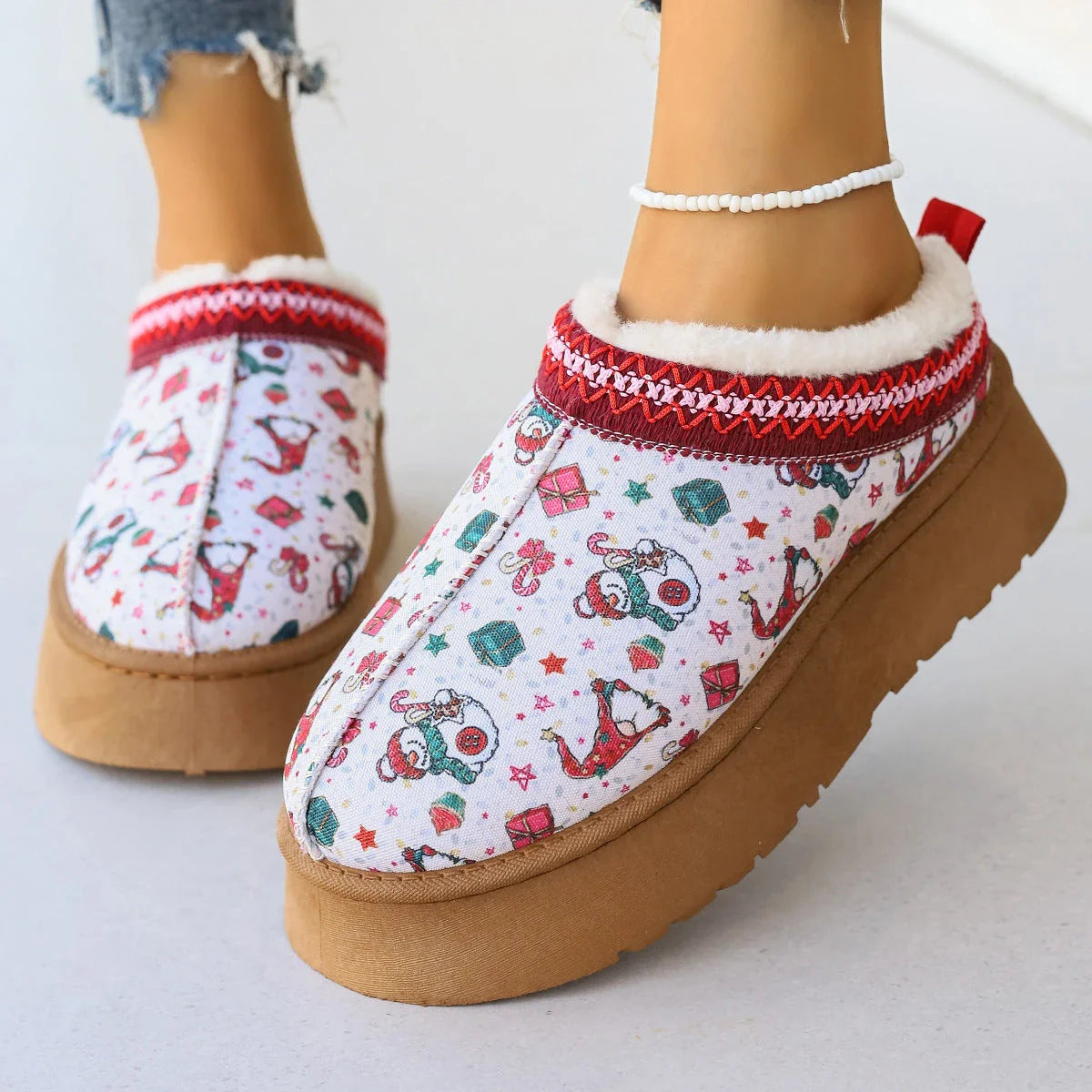 Cozy women's Christmas ankle boots with plush lining and slip-on design in festive snowman, bear, red, and Santa Claus designs