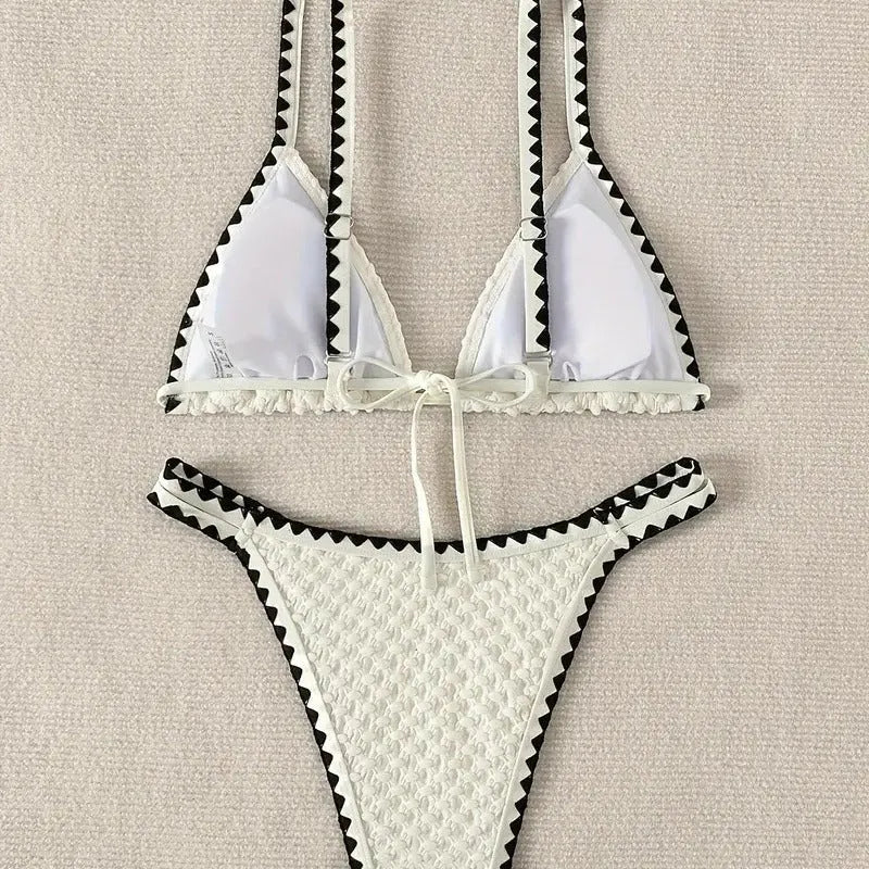 Women's two-piece split bikini swimsuit in white and blue colours with brief-style cut
