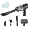 Black handheld car vacuum cleaner with USB charging port showing portable design