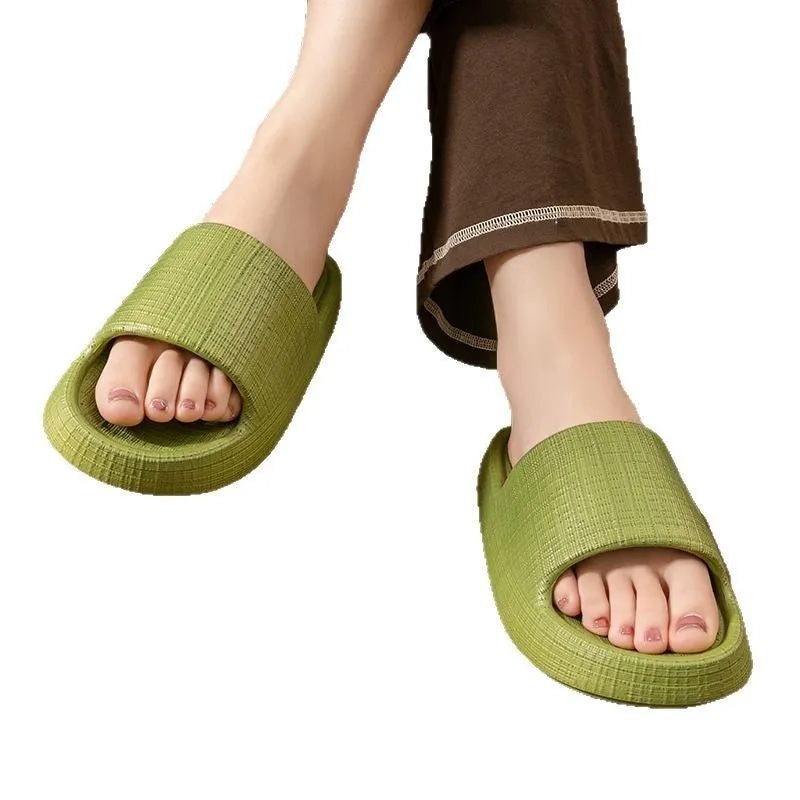A pair of khaki coloured EVA toe ring slippers with a soft non-slip sole, shown on a white background.
