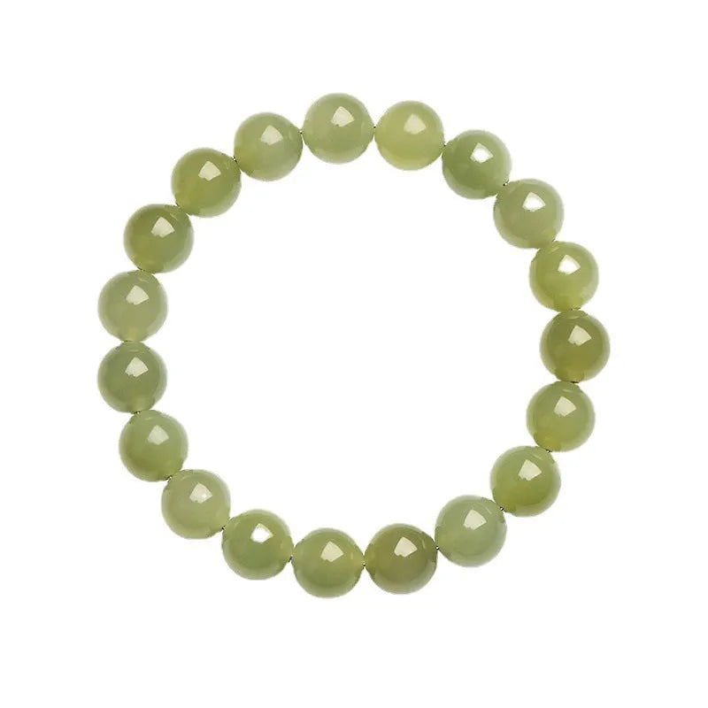 Hand-polished Hetian jade ball bracelet on wrist, showing deep water clear beads.