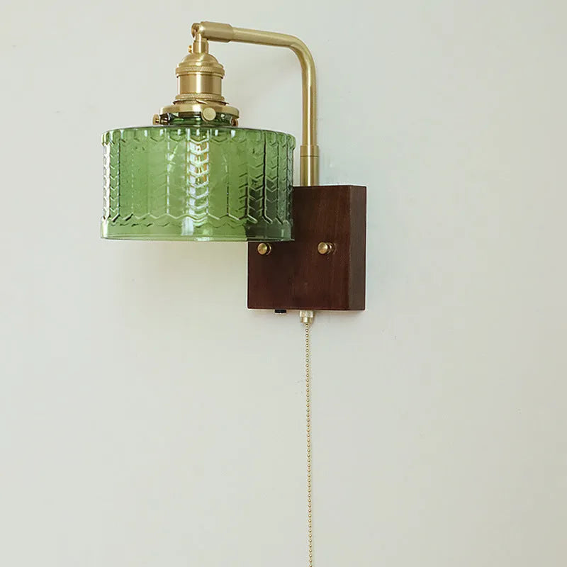 American retro wall lamp with walnut glass brass construction, green glass shade, installed on living room wall