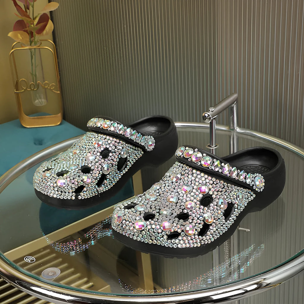 Black women's platform sandals with rhinestone detail and hole design on EVA upper