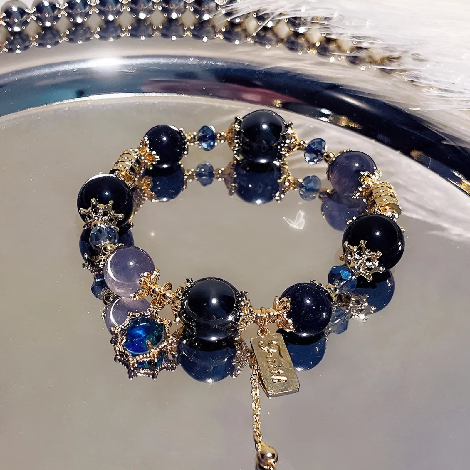 Women's Galaxy colour bracelet with snowflake pendant, bow charm, and cartoon character design