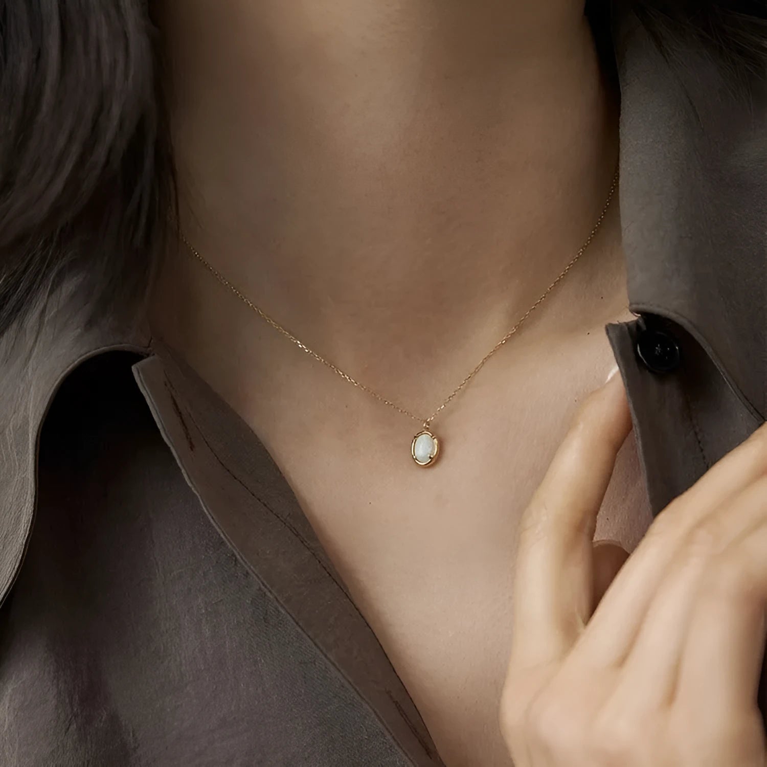 Oval geometric jelly opal pendant necklace with silver plating in gold or white gold colour.
