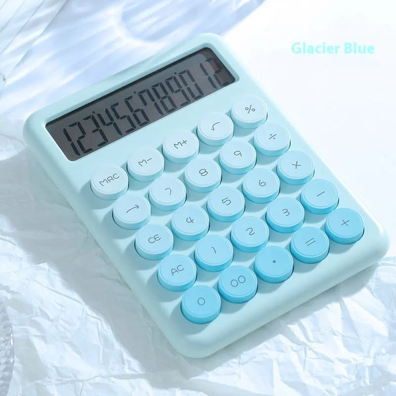 Dopamine gradient colour desk calculator in violet, pink, blue, and green on a white desk.