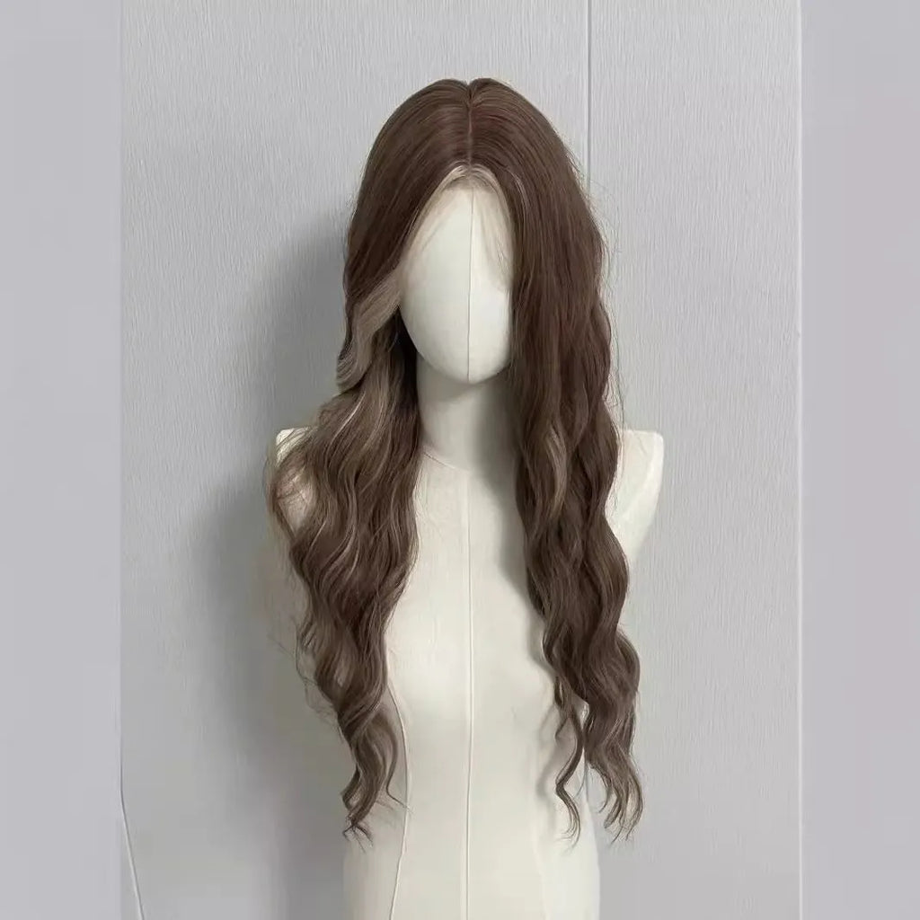 A long curly synthetic wig in a lace grey gold colour on a mannequin head.